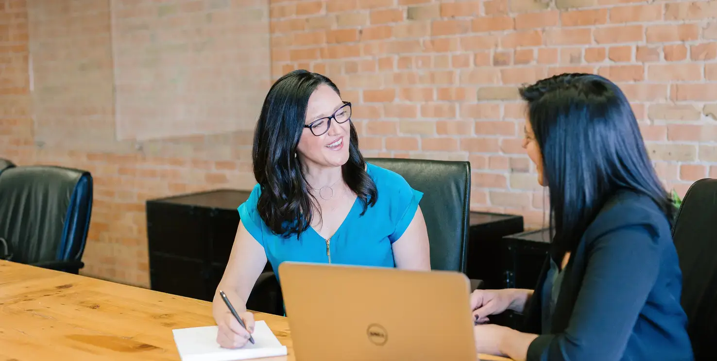 Woman discussing selling her home with a Realtor