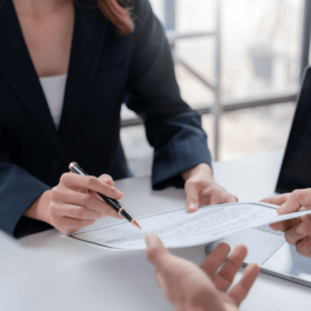 Real estate agent presenting a seller with a listing agreement